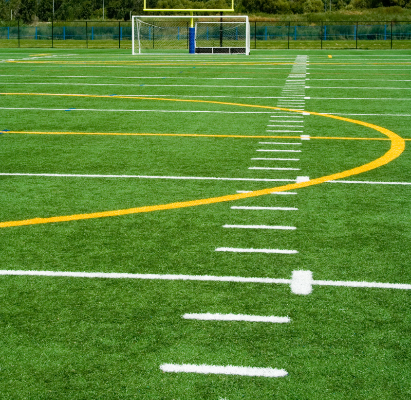 a large football field with synthetic turf